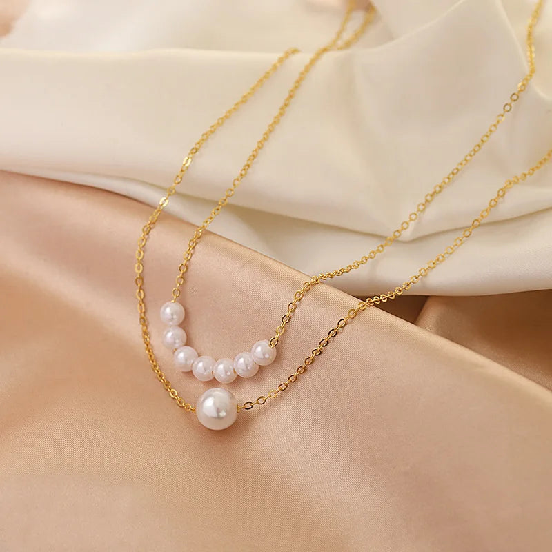Elegant Multi-Layer Pearl Necklace with Heart Pendant – Trendy Choker for Women